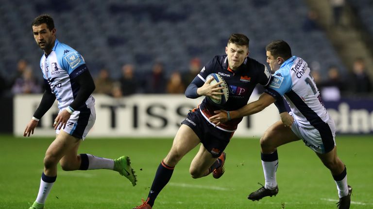 Blair Kinghorn of Edinburgh Rugby runs with the ball